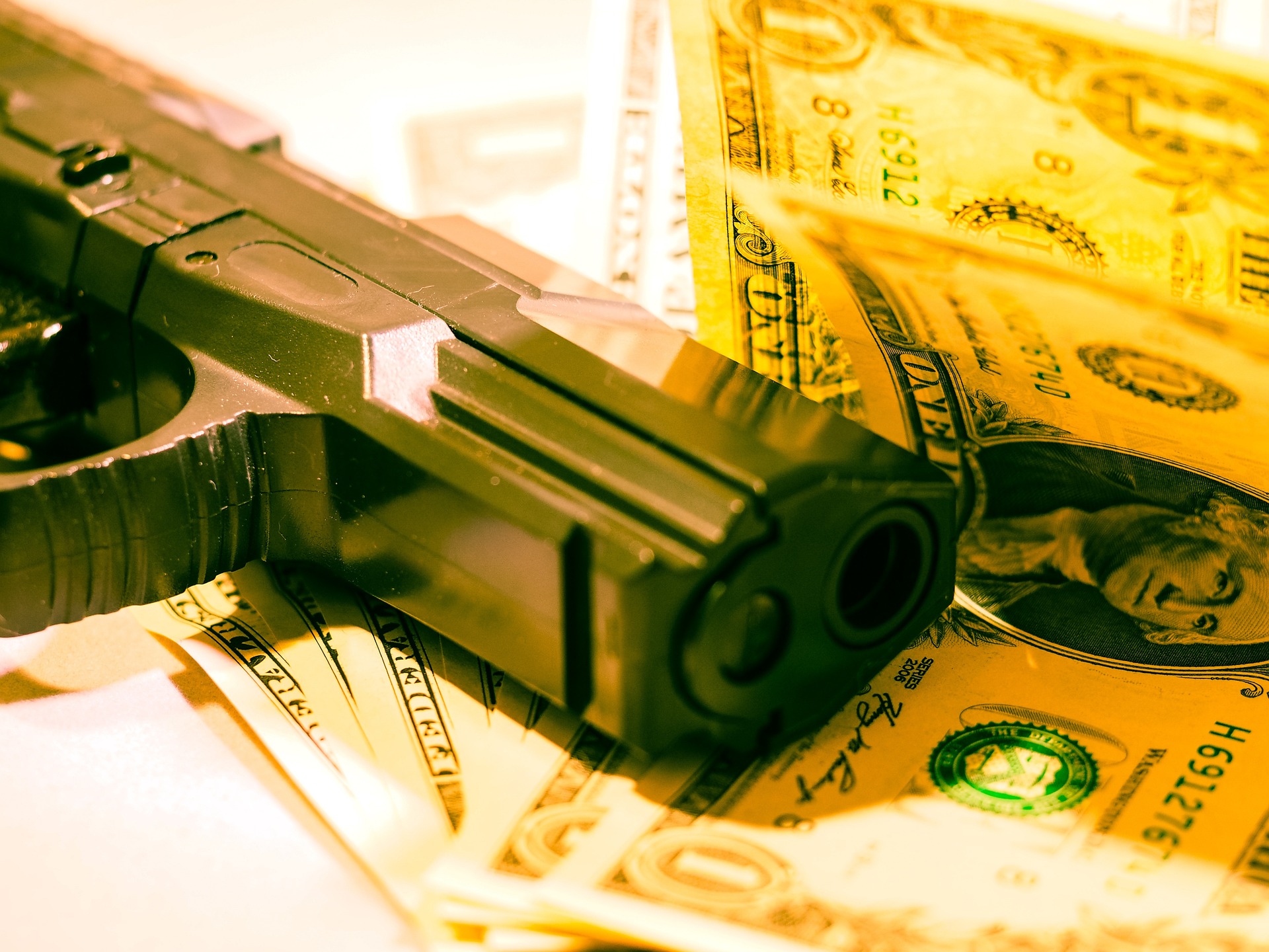 Gun Money Robbery Stock Photo