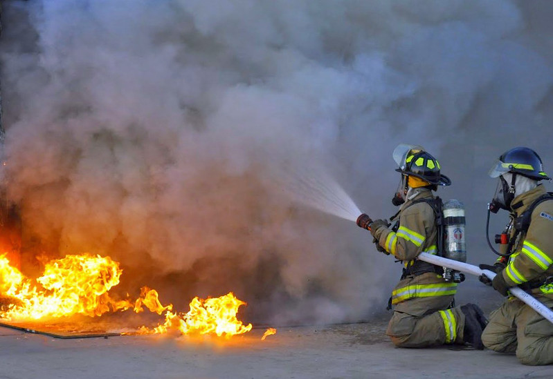 Firefighters Attacking a Fire - Stock Photo