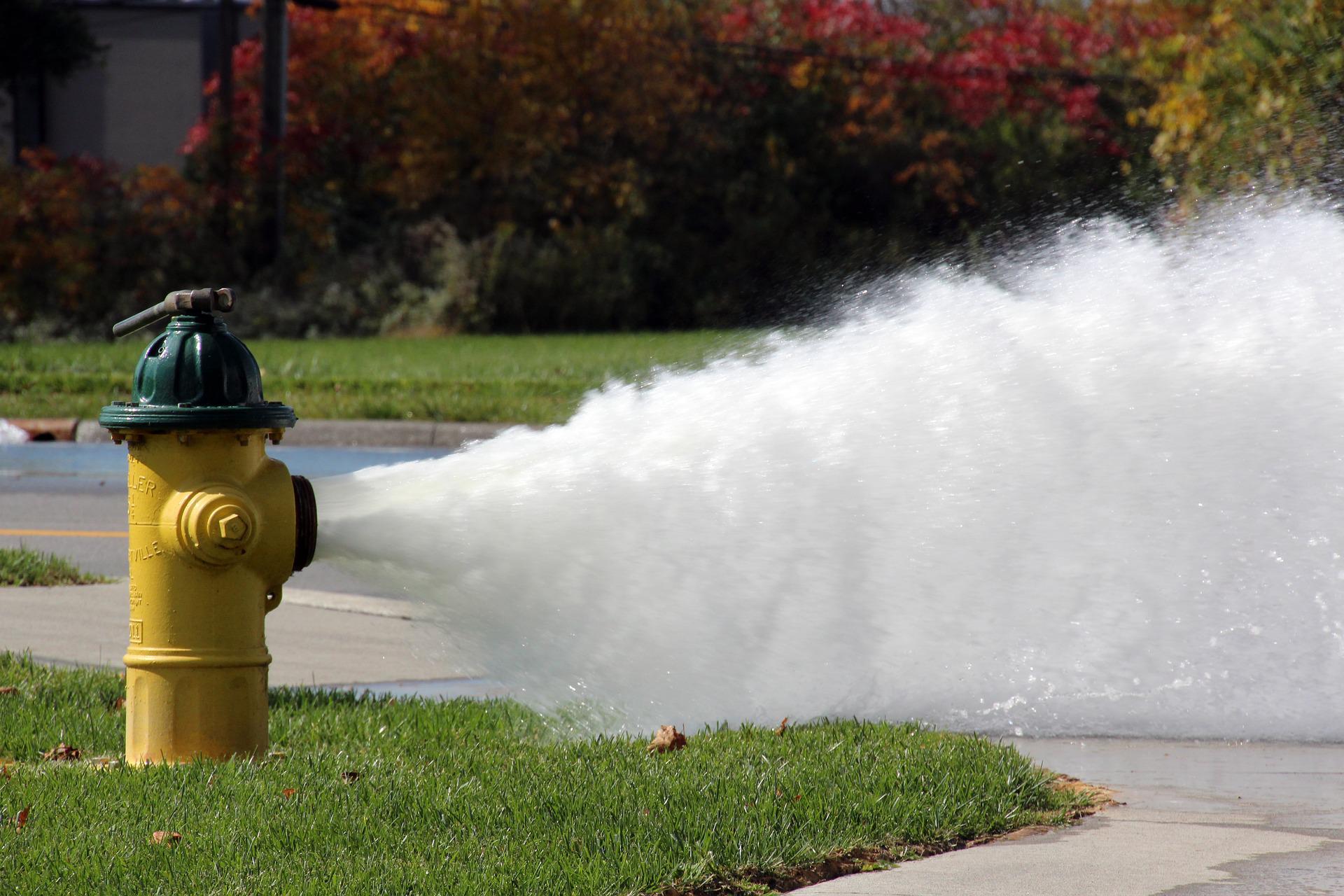 Open Fire Hydrant Stock Photo