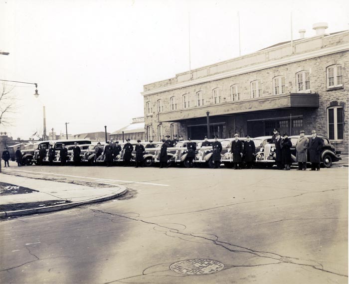 Late 1930s Camden Police Department vehicles on Argonne Street in front of Convention Hall with police and city officials