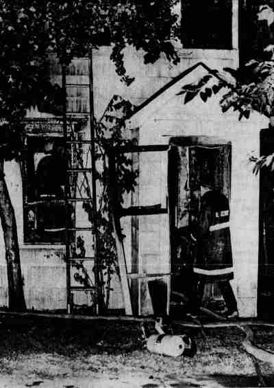 Fireman at 917 North 30th Street fire — Camden Courier-Post, August 16, 1968