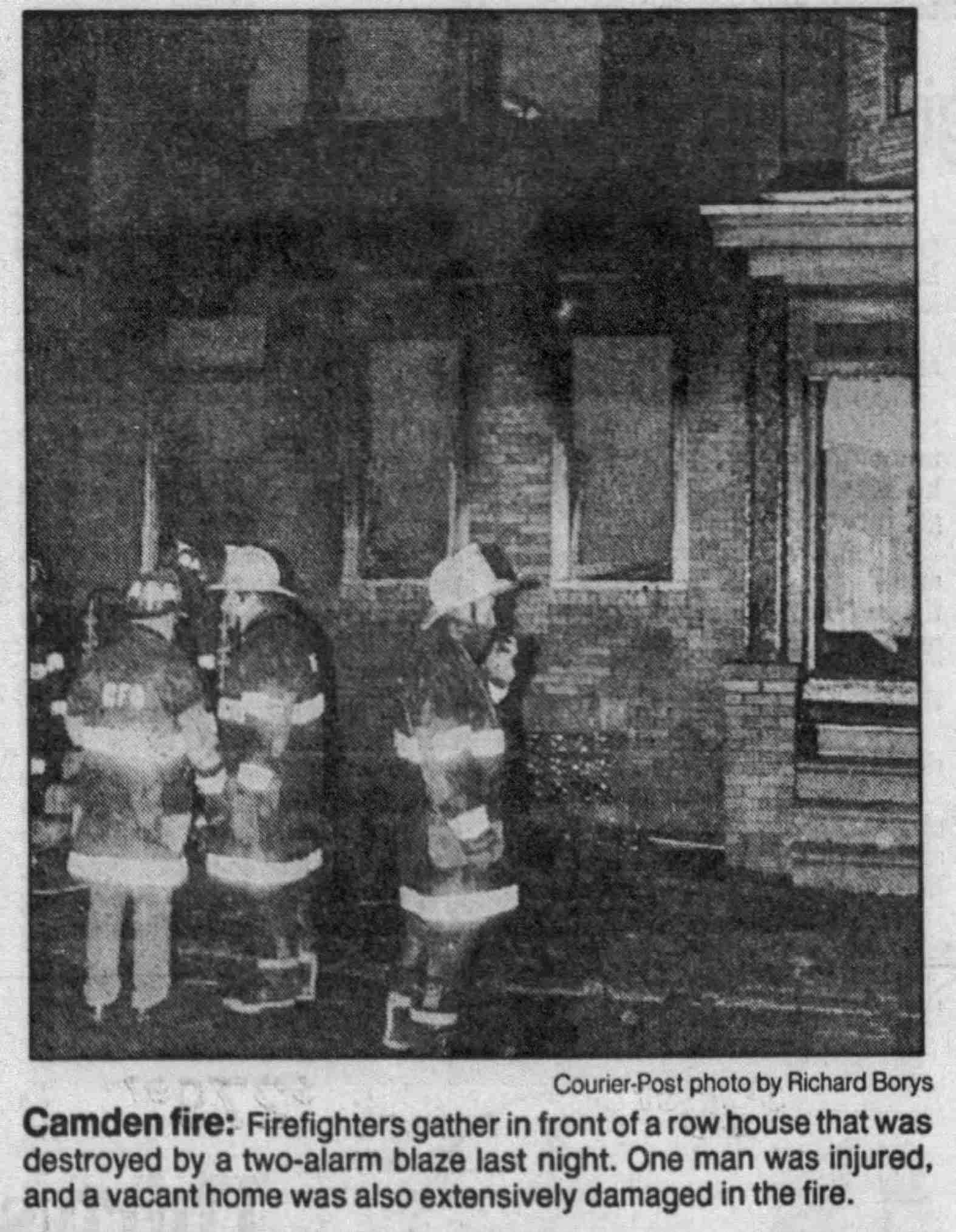 Firefighters at the destroyed row house, 1143 Sheridan Street, December 1989