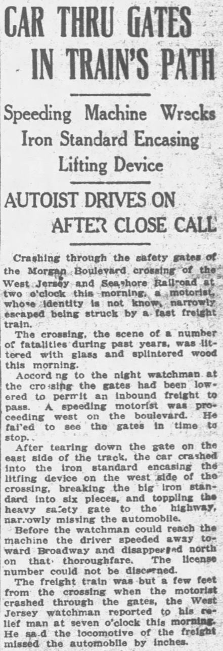 Car through gates in train's path at the Morgan Boulevard railroad crossing