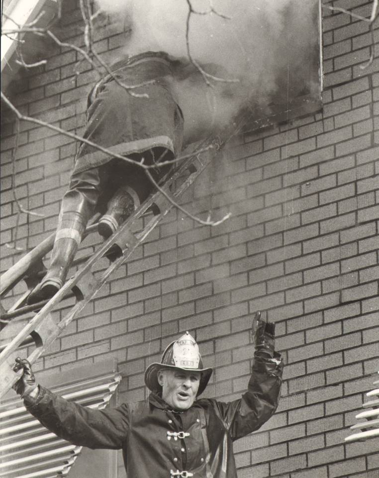 Captain Chester Gedrich directing, with Henry Keating on ladder, January 18, 1974