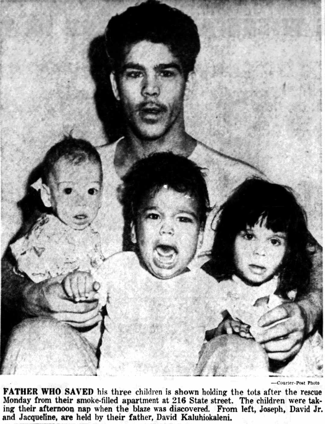 David Kaluhiokaleni with his three rescued children