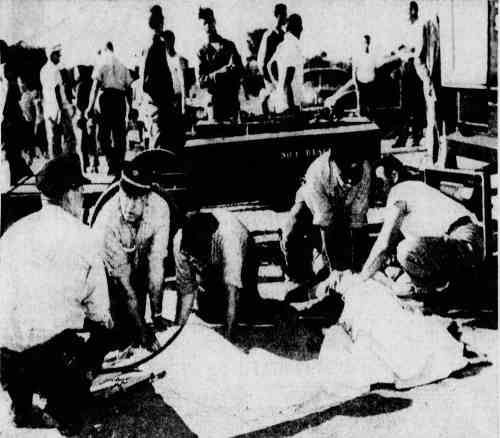 Camden firemen working over the drowned Drummond children at Cooper River Park