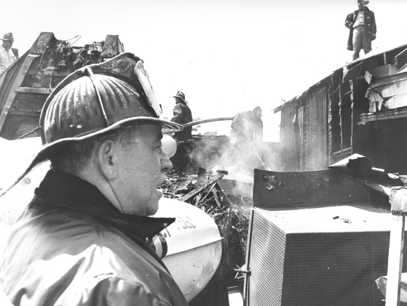 Captain Arthur C. Batten with Rescue Company 1 at a junkyard fire, June 1964