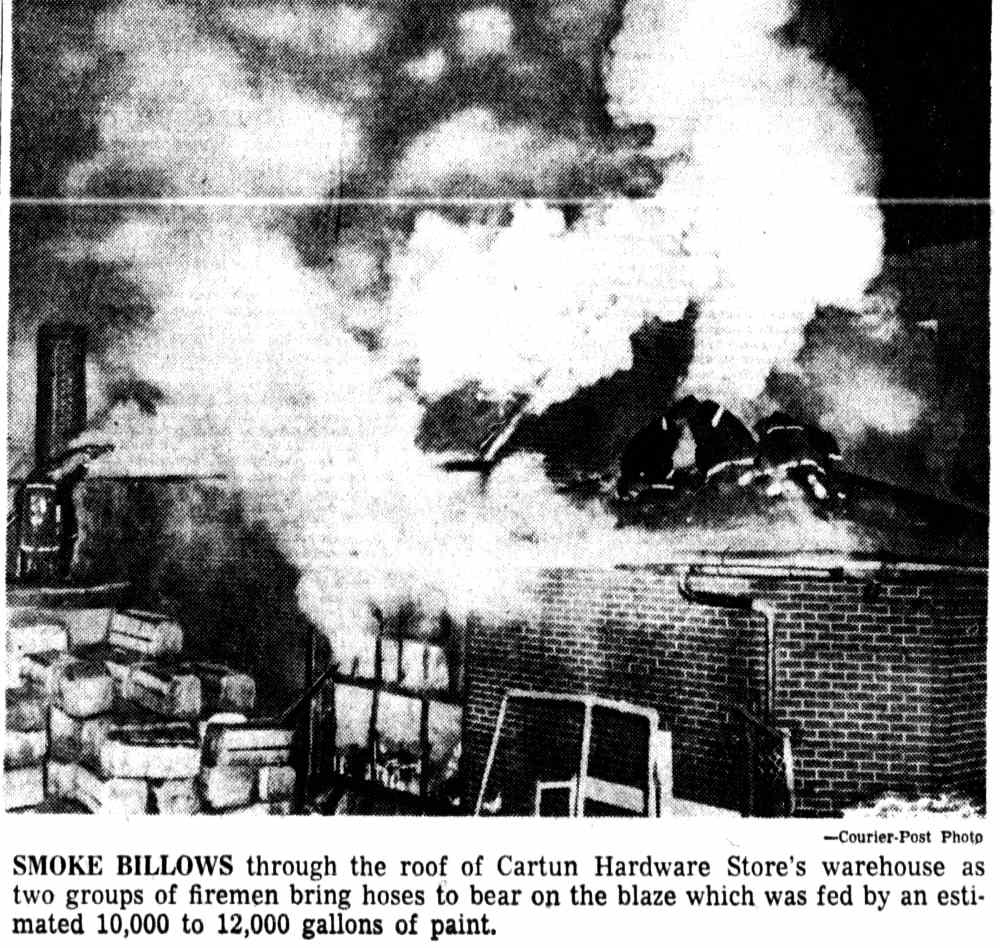 Smoke billows through the roof of Cartun Hardware Store's warehouse, Camden Courier-Post, December 22, 1961