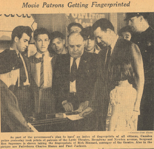 Camden police sergeant fingerprinting a theatre manager while moviegoers look on, Courier-Post, June 30, 1939