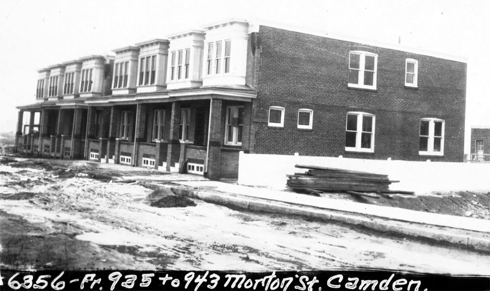 Newly built brick rowhouses at 935 to 943 Morton Street, Camden, under construction around 1928