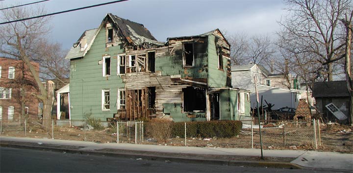 Wide view of the burned house at 88 Dudley Street